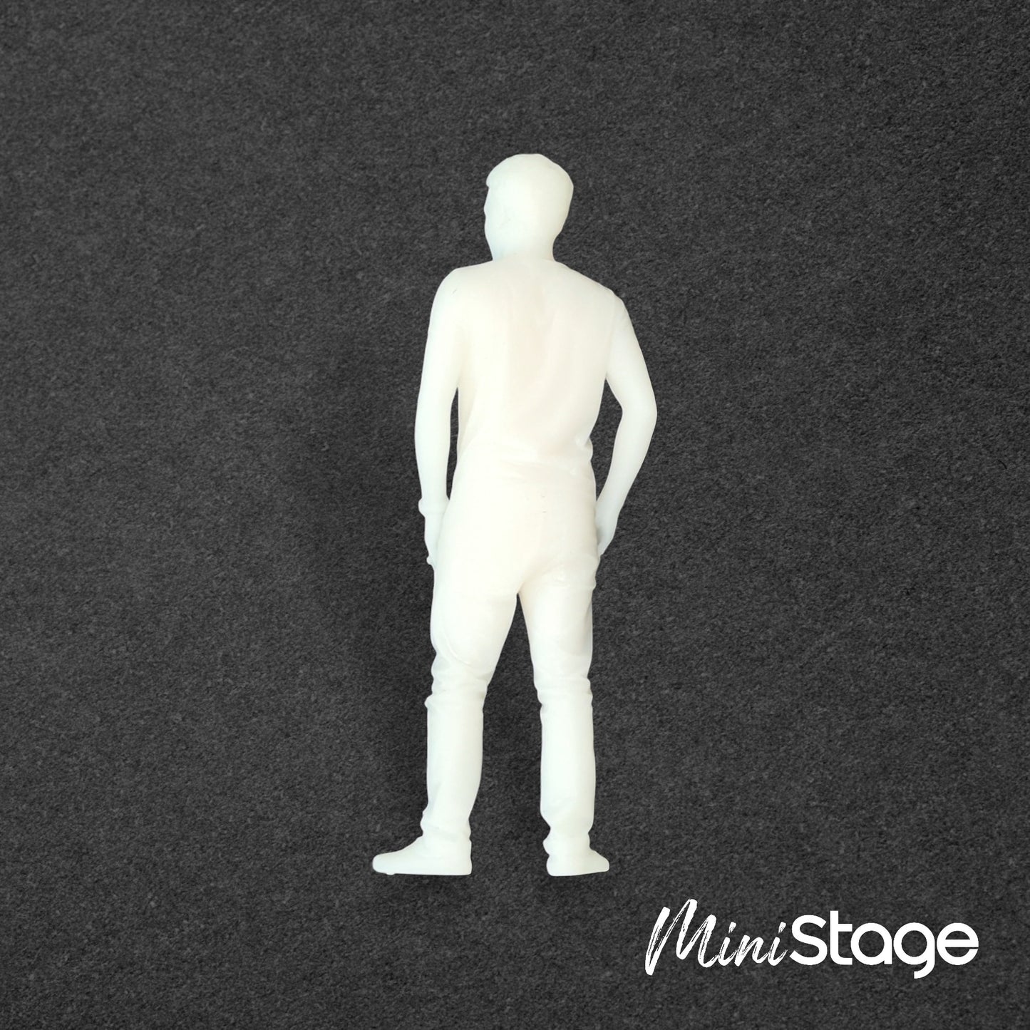 Alex - Figure of a male with short hair standing with his hands in his pockets wearing jeans, t-shirt
