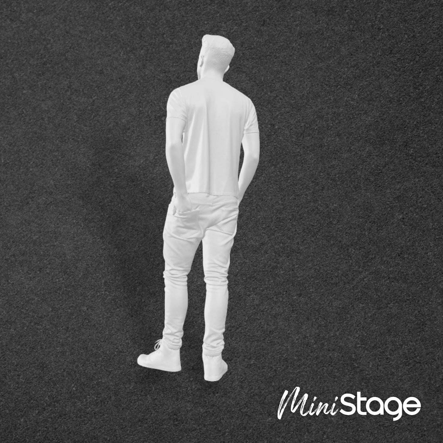 Thomas - Figure of a male standing wearing jeans and a t-shirt, with his hands in his back and frount pockets