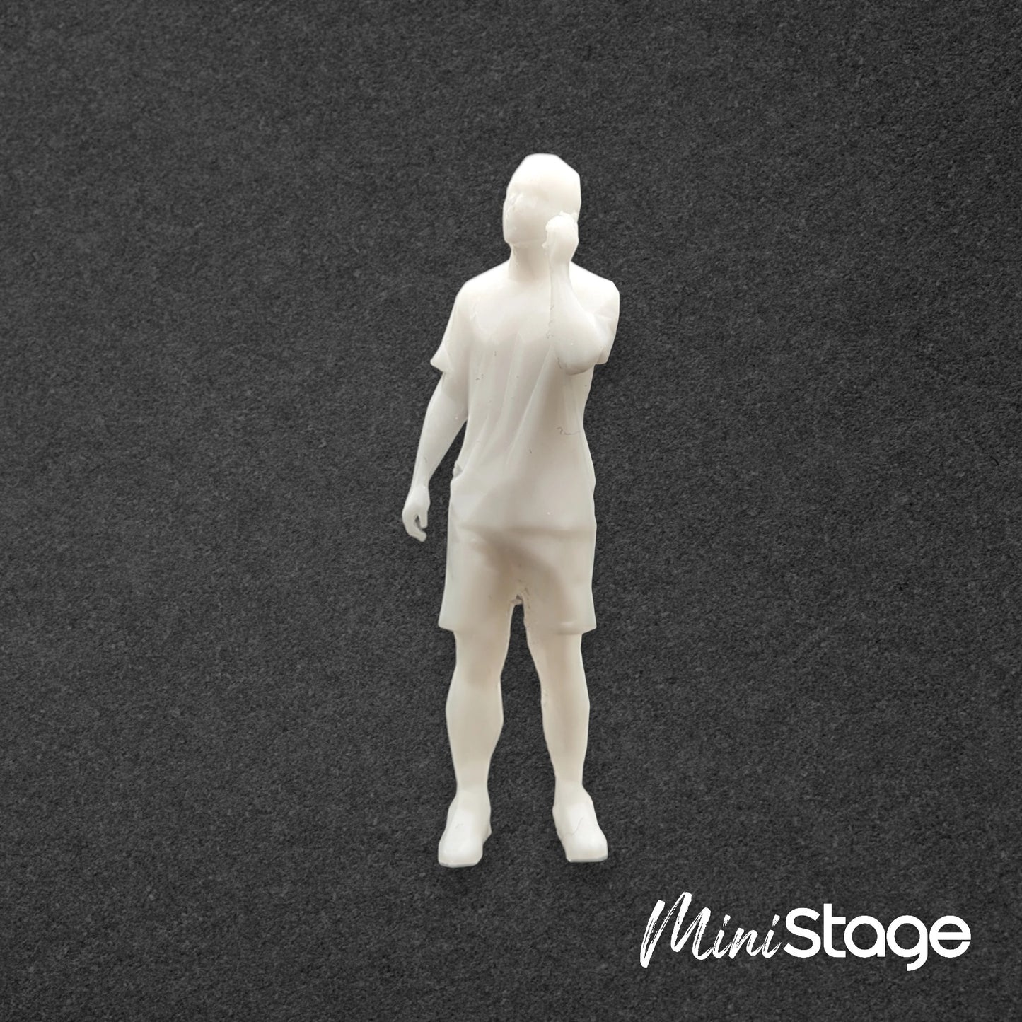 Oliver - Figure of a male Standing wearing casual clothing, t-shirt, shorts and has a mobile phone.