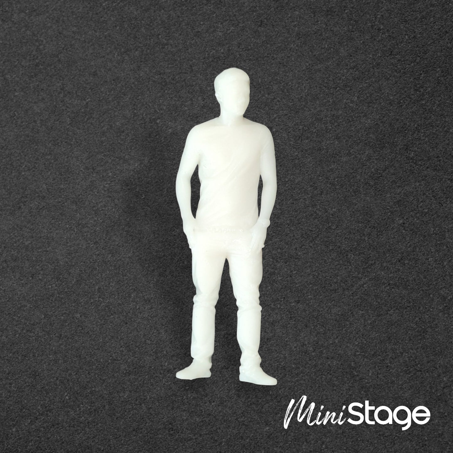 Alex - Figure of a male with short hair standing with his hands in his pockets wearing jeans, t-shirt