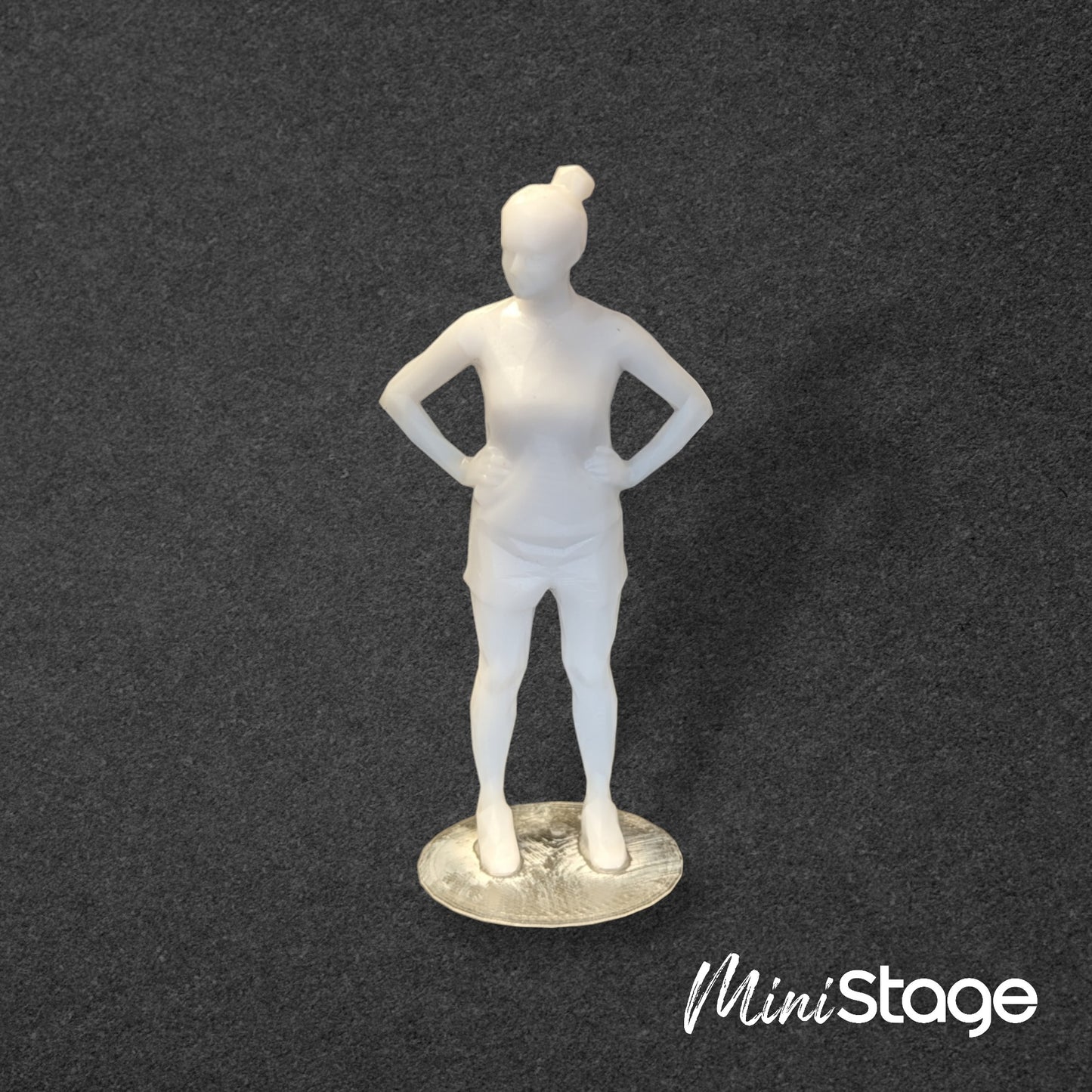 Janet - Set of Three Low Poly Scale Figures of a Woman Sitting and Standing with a Bun.