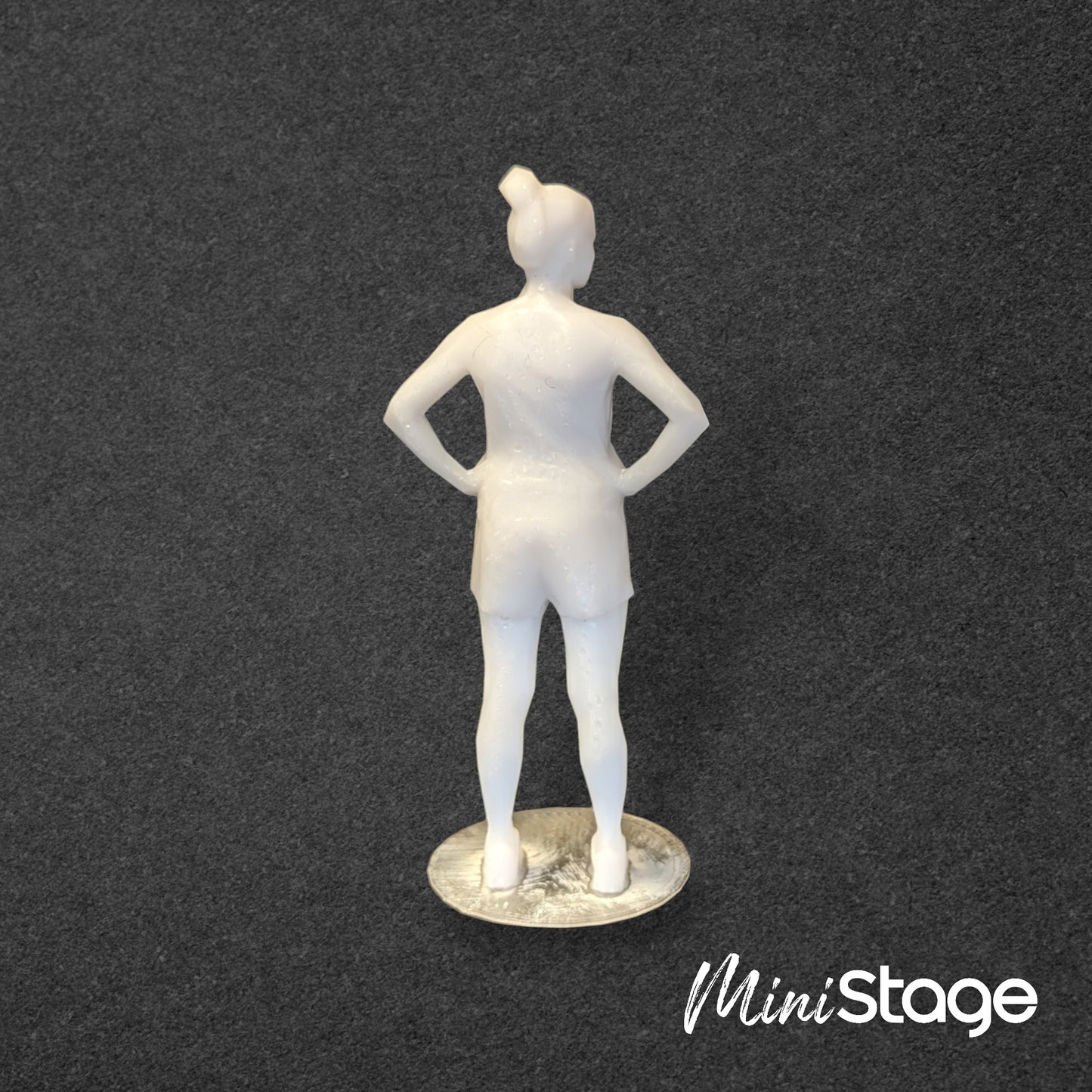 Janet - Set of Three Low Poly Scale Figures of a Woman Sitting and Standing with a Bun.